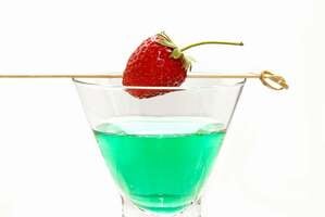 green grinch cocktail in the a tall cocktail