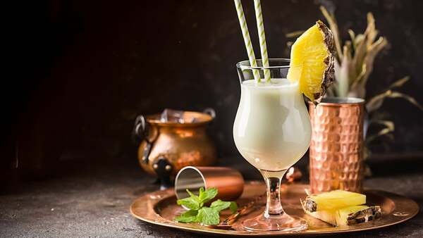pina colada with pineapple served on the side