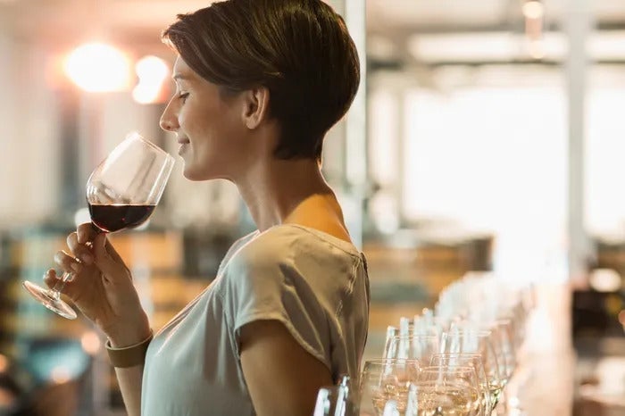 a woman holding a wine glass